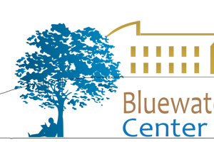 Bluewater Center logo featuring orange and blue text and a blue illustration of a person reading a book under a tree